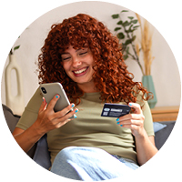 Girl with red hair online shopping with MHV debit card