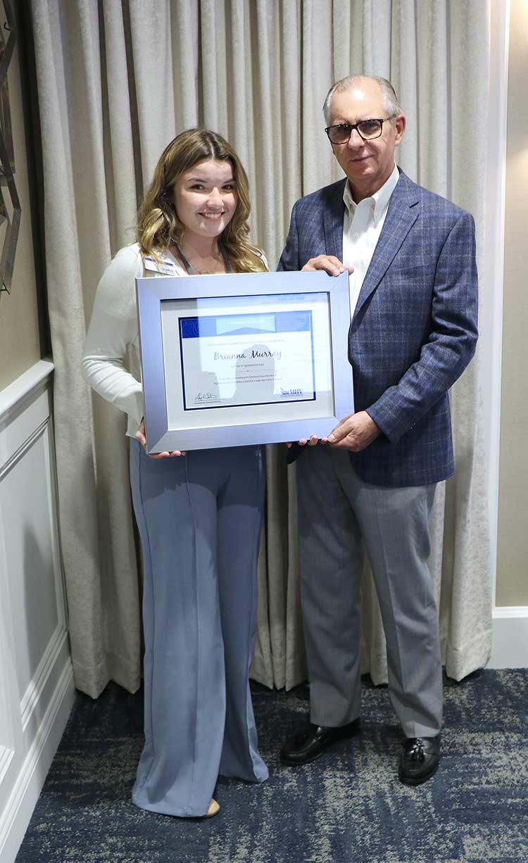 Brianna Murray with Gary Anderson, Chairman of the Board