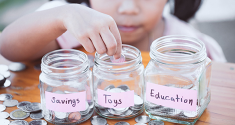 Child separating change in jars