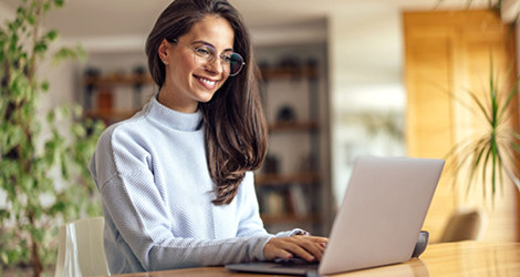 Woman applying for loan on laptop