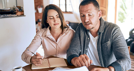 Middle age couple looking at finances